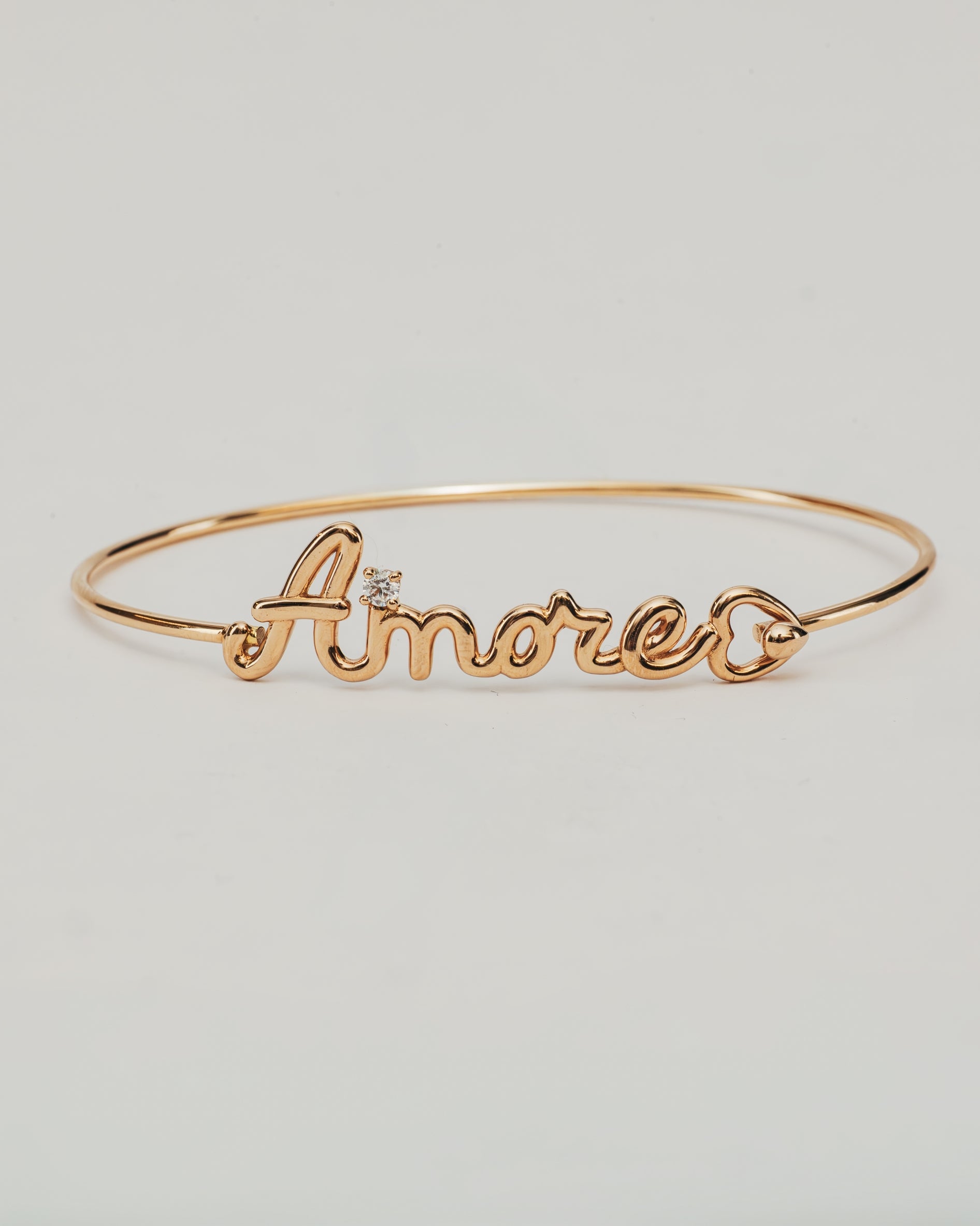 Bracciale Rigido Dorato Amore con Punto Luce