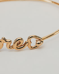 Bracciale Rigido Dorato Amore con Punto Luce