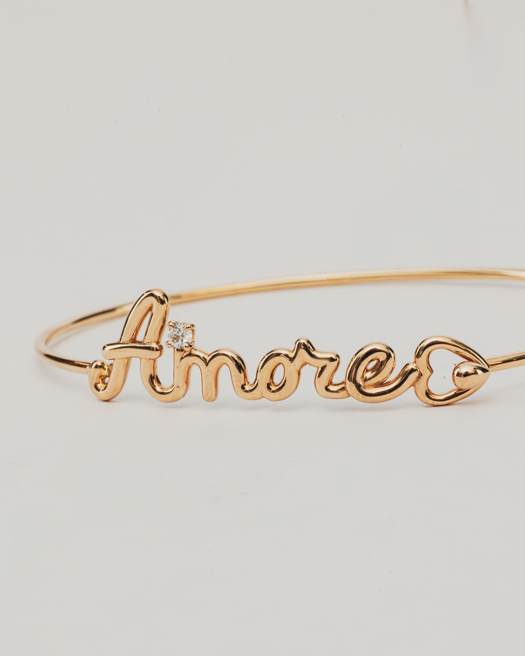 Bracciale Rigido Dorato Amore con Punto Luce