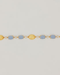 Bracciale Dorato con Pietre Cabochon e Dettagli Luminosi