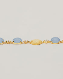 Bracciale Dorato con Pietre Cabochon e Dettagli Luminosi
