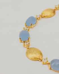 Bracciale Dorato con Pietre Cabochon e Dettagli Luminosi