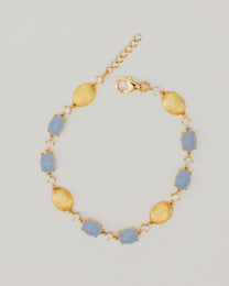 Bracciale Dorato con Pietre Cabochon e Dettagli Luminosi