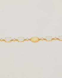 Bracciale Dorato con Pietre Cabochon Bianche e Dettagli Luminosi