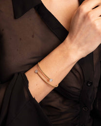 Bracciale Rigido Dorato con Terminali Punto Luce