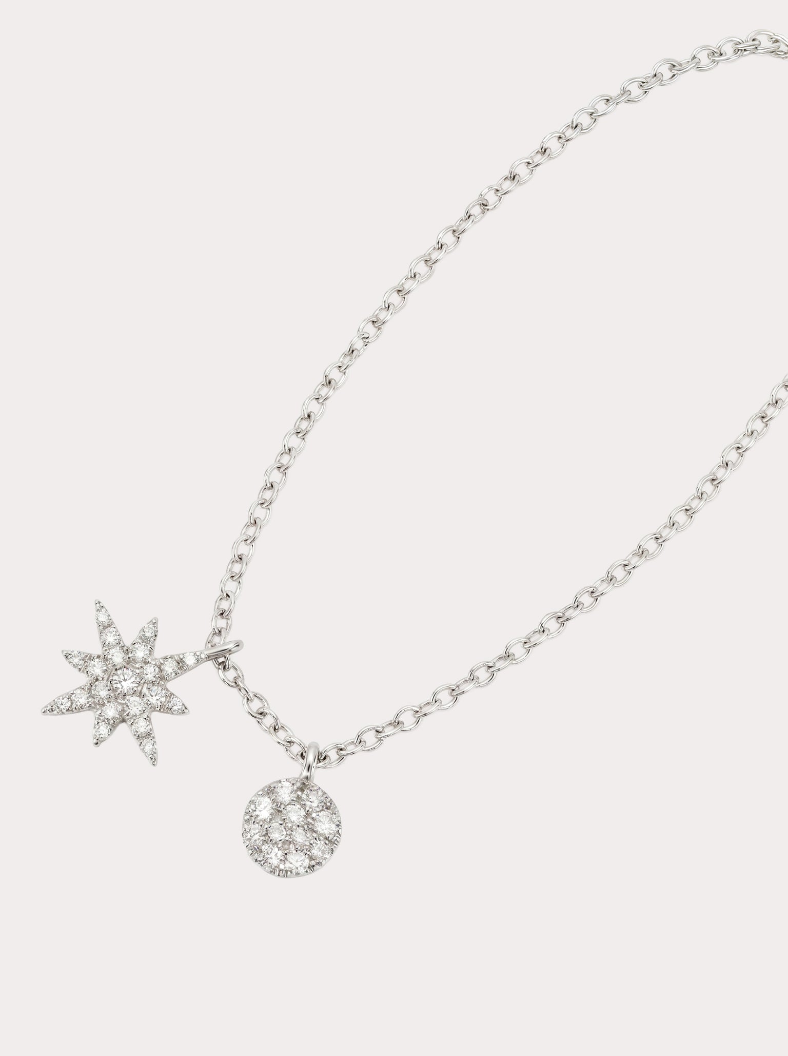 Collana con rosa dei venti in oro bianco e diamanti
